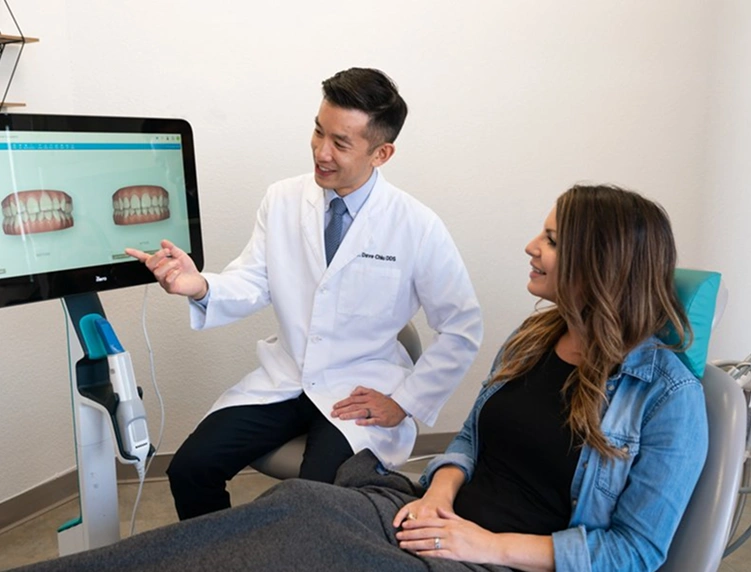 Dentist showing a patient a digital preview of her smile